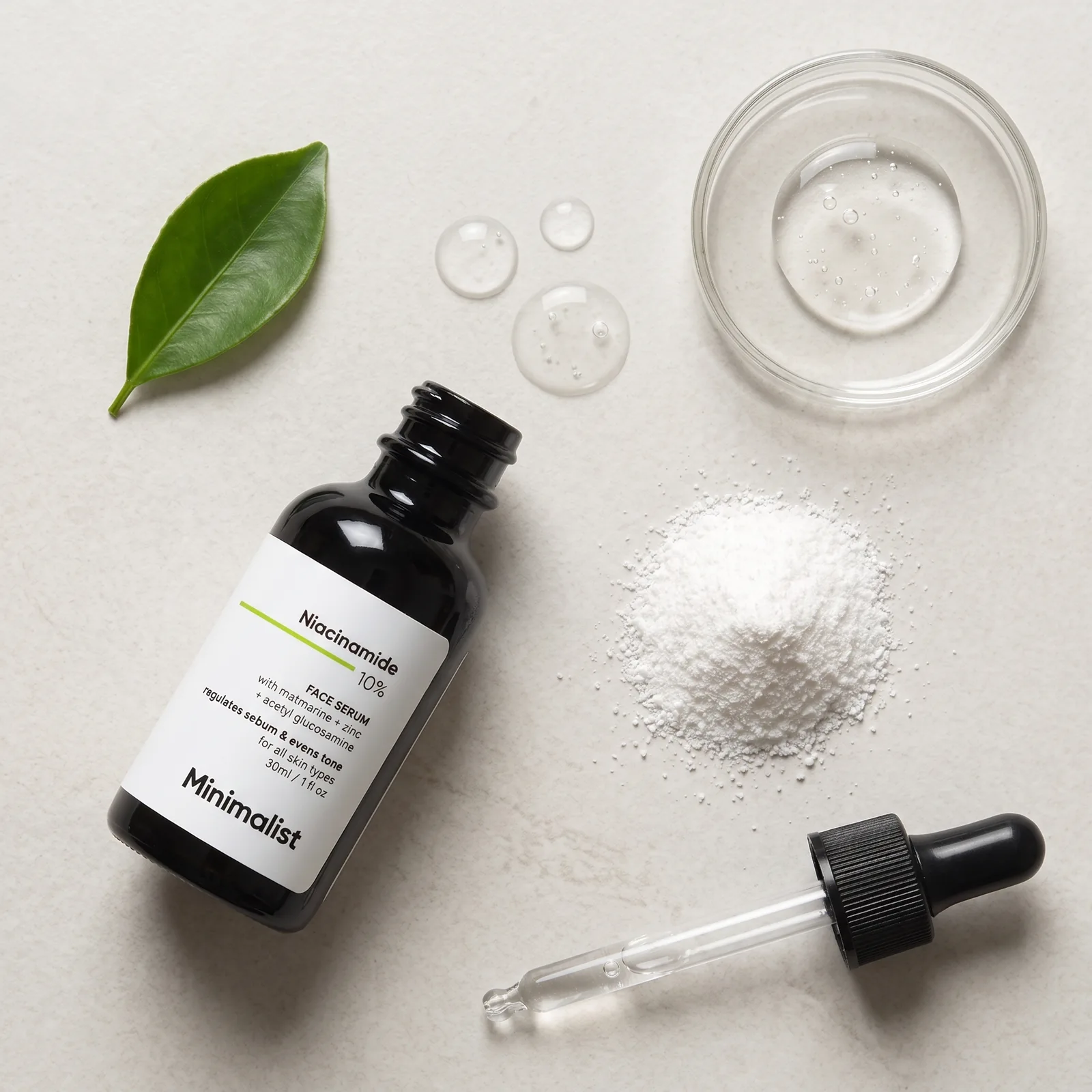 Minimalist serum ingredient flat lay